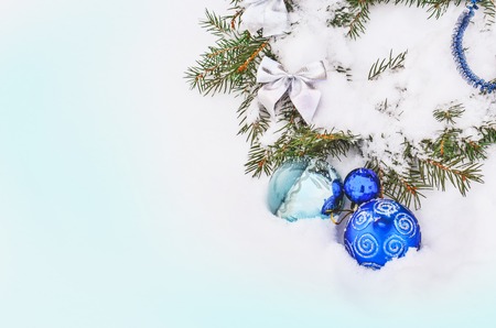 Blue christmas balls. Decorative Christmas background. Christmas background in blue colors with fir branches, ornaments.の写真素材