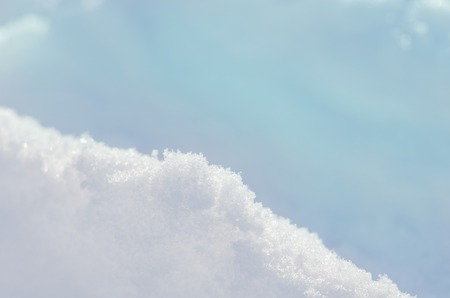 Beautiful natural snowdrift background. Natural snow shiny drifts. Merry Christmas and happy New Year backgroundの写真素材