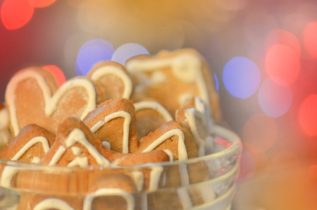 Background with gingerbread cookies. Gingerbread cookie on on abstract blurry bokeh background