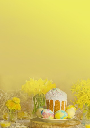 Pastel Easter egg. Pastel colored decorated easter eggs and Easter cake. Pastel colored Easter holiday background.View with copy spaceの写真素材