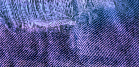 Blue torn grunge denim jeans texture. Jeans bit tornの写真素材
