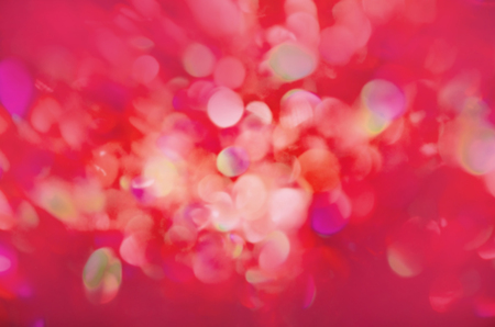 Shining red background. Abstract Red defocused lights background. Christmas red lights background....
