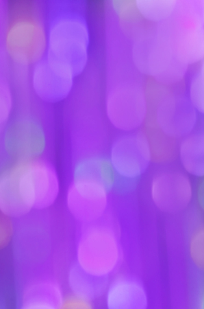 Festive Christmas elegant abstract background.  Defocused purple lights background. Ultra violet...