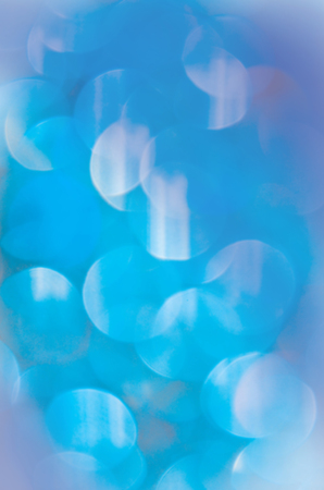 Abstract background with blue bokeh lights. Defocused blue lights backgroundの写真素材