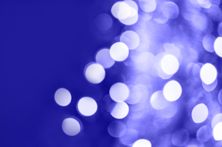 Glittering blue background. Abstract blue bokeh background.