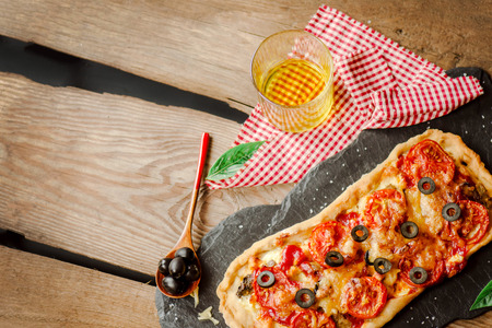 Margarita pizza with mushrooms, mozzarella cheese and cherry tomatoes.  Empty place for text.の写真素材