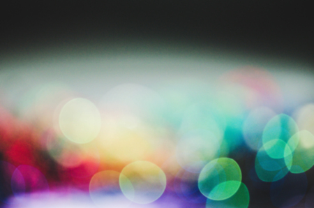 Abstract blur city bokeh lights. Defocused bokeh street in European city background. City blurred lights background. Night bokeh lights in big cityの写真素材