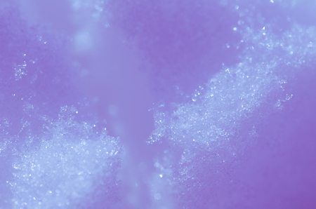 Snow on a sunny day. Winter Christmas background with snowの写真素材