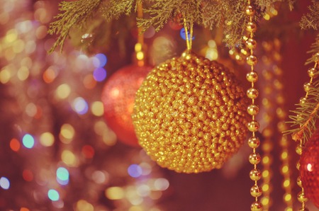 Christmas and New Year branch. Christmas gold decoration ornament background. Christmas gold ball on...