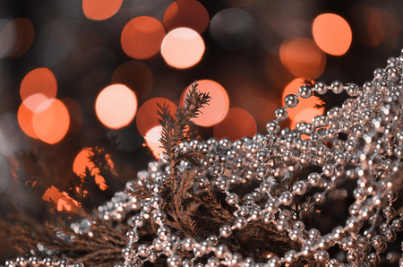 Fresh fir branches and silversilver ornaments macro. Christmas silver decorations and branches firの写真素材