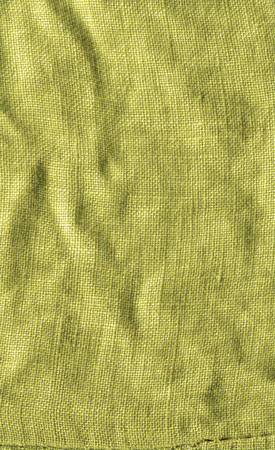 Mustard yellow cloth fabric. Mustard color fabric closeupの写真素材