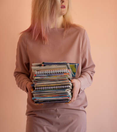 Lovely girl holding copybooks in her hands. Portrait with copy space empty place. Portrait of smart...