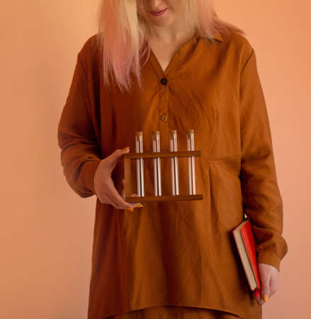 Student scientist researching and learning. University chemistry  learning.  Student female holding...