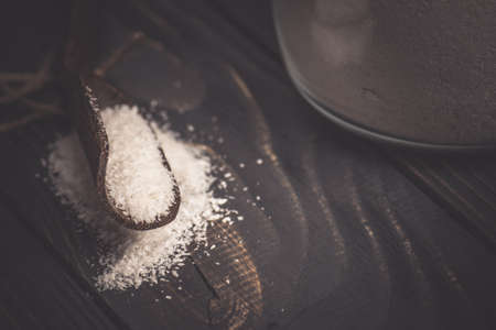 Nut with fresh coconut flakes. Glass bowl of coconut shavings. Grated coconut in glassの写真素材