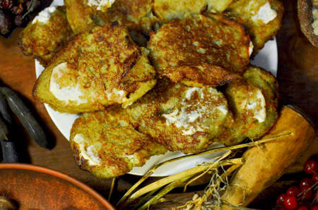 Naditional Ukrainian dish potato fritters deruny. Naitonal dish in Ukraine. Pancakes of grated...