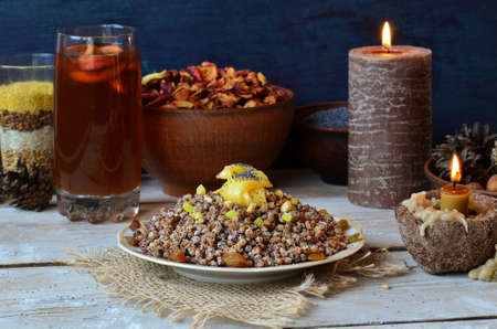 Traditional Christmas kutya with candied orange in the shape of a star. Decor in the form of stars...