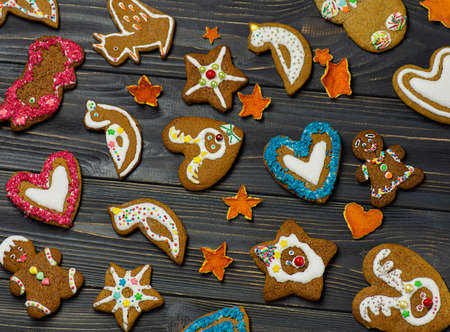 Celebration and cooking concept with christmas decoration and gingerbread cookies on wooden...