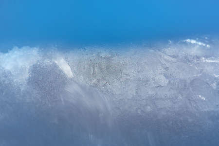 Abstract bright ice background with copy space. Winter ice patterns.