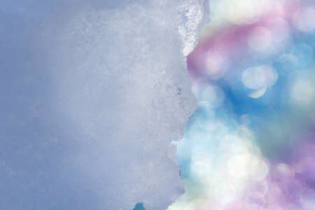 White ice sparkling on abstract blurred background. Beautiful abstract sparkling ice background.