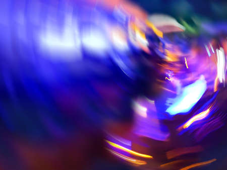 Colorful abstract dynamic defocused light trails. Sphere decorative backdrop with sparks flying.の写真素材