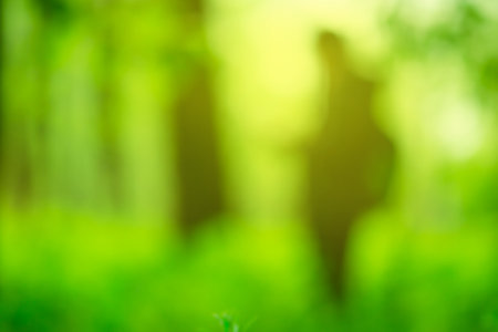 Blurry silhouette of a girl figure with bokeh effect. Girl on blurred bokeh background.の写真素材