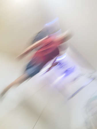 Abstract blurred people walking. Blurry abstract background with blurred crowds diverse ages and genders.の写真素材