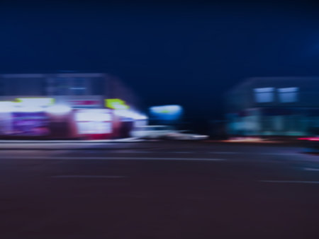 High speed motion car and colorful light trace. Motion blurred car in the city street concept.