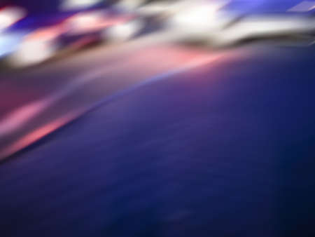 Abstract colorful blur bokeh night city life. City blur view cityscape with office building landscape at night.の写真素材