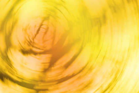 Blurry falling leaves natural bokeh background. Falling leaves natural blurred bokeh background.の写真素材