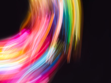 Abstract dark neon defocused bokeh background and blurry effect. Neon light blurred bokeh out of focus background.の写真素材