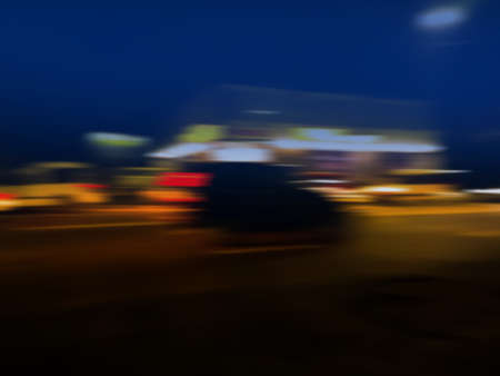 Urban night walk blurred background. Abstract colorful blur bokeh night city life.