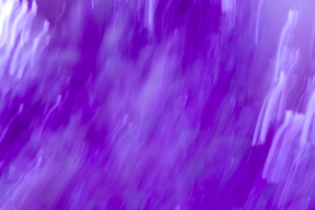 Violet bokeh abstract light background. Motion blur violet backdrop.の写真素材