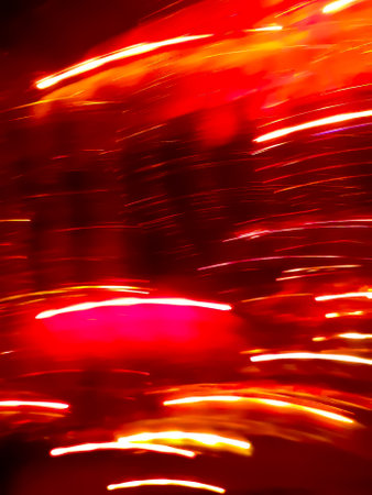Valentines day vermillion red background. Soft bokeh defocused crimson red rose holidays light...
