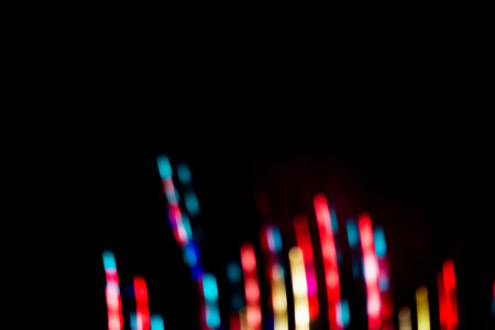 Light neon abstract on black background blurry effect.