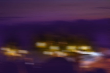 Abstract urban night defocused background. Abstract colorful bokeh night city background.