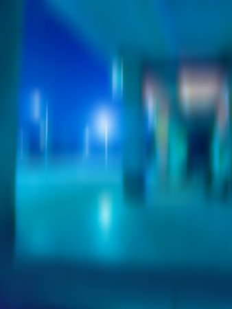 Central bus terminus for intercity bus service at night blurry  background. Busway stations at night city blurred texture.の写真素材