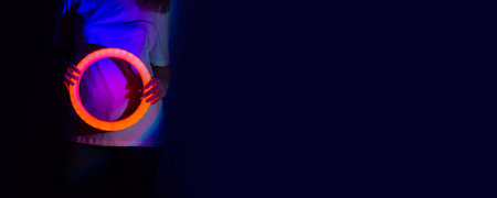 Portrait of young beautiful lady dancing on the stage with vibrant bold gradient neon holographic...