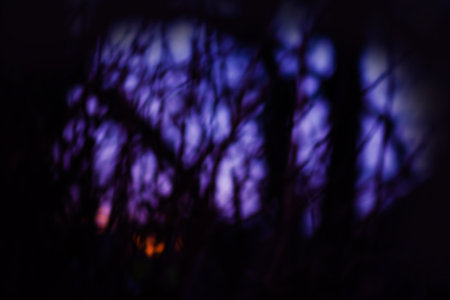 Frightening darkness and ray of light blurred texture. Bokeh shadows and light.の写真素材