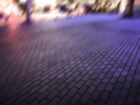 Abstract night light bokeh defocused background. Blurred urban building background scene.の写真素材