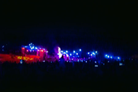Guests of the music event on open air festival in the park blurred effect background.の写真素材