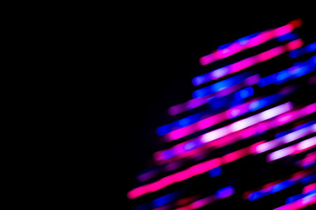 Iridescent light neon colors blur background. Vapor wave vibrant blurred bokeh gradient texture.の写真素材