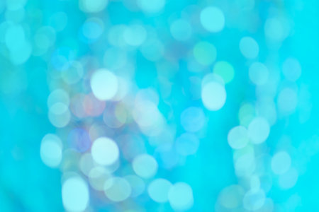 Blue cool creative backdrop with out of focus light balls. Abstract colorful blur blue texture backgroundの写真素材