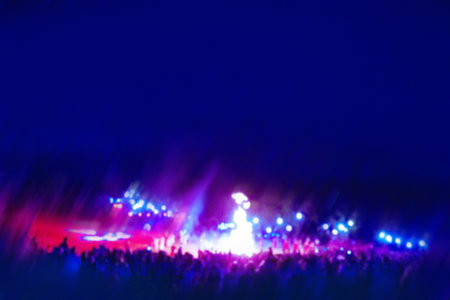 Open air festival outdoors in the park blurred background. Guests of the music modern futuristic festival outdoors in the park background.の写真素材