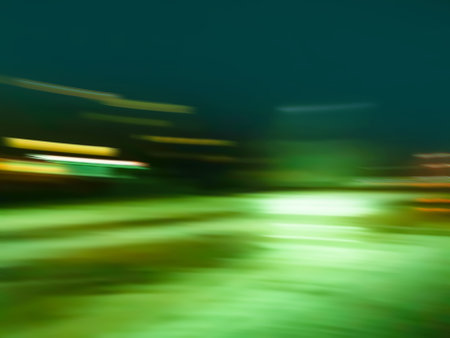 City night blur bokeh background. Blurry city skyline at night with defocused buildings.の写真素材