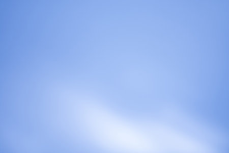 Sunshine rays glowing light blurred motion out of focus background. Light blur radiance on blue sky background.の写真素材