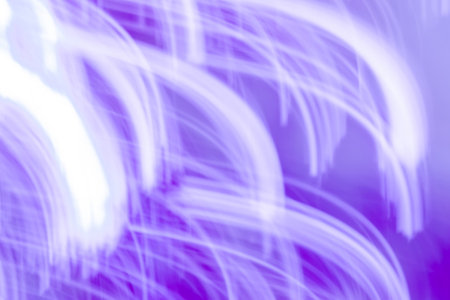 Bright glow radiance on blue blurred bokeh background. Shimmering glow sheen on blurred background.の写真素材