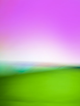 Natural outdoors blurry effect green rolling hills and blue sky with sunset in summer field.の写真素材