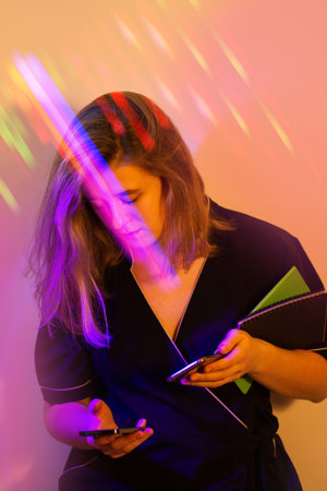 Young woman communication with the client by phone in therapy salon.
