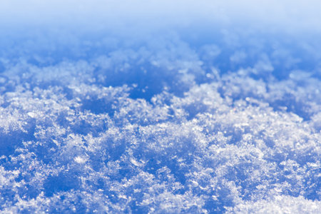 Abstract bright snowy background with copy space. Snow white texture.の写真素材