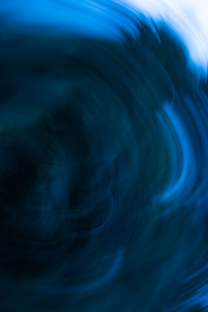 Deep cool tones and diffused light create a chilling visual effect in this dark blurred background.